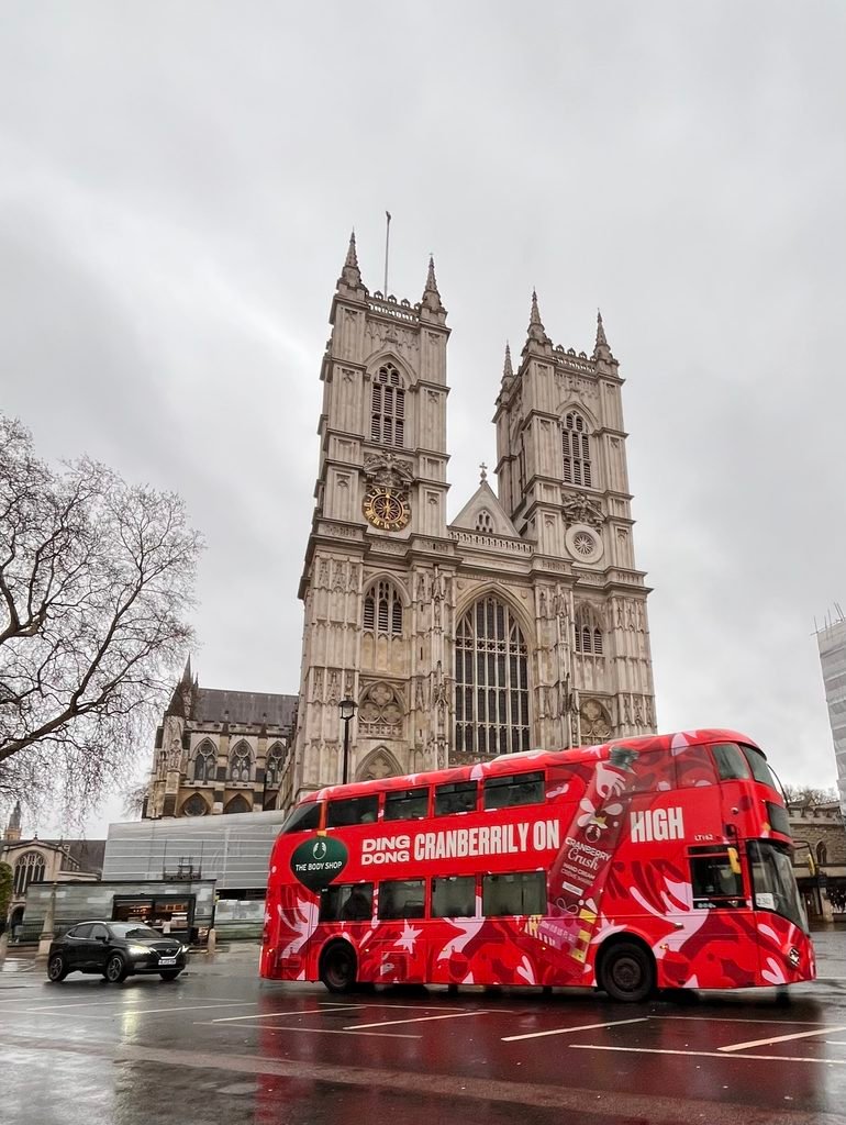 Red bus infront of Westminster Abbey